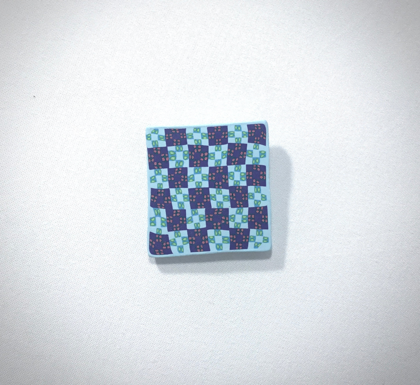 Checker board pin